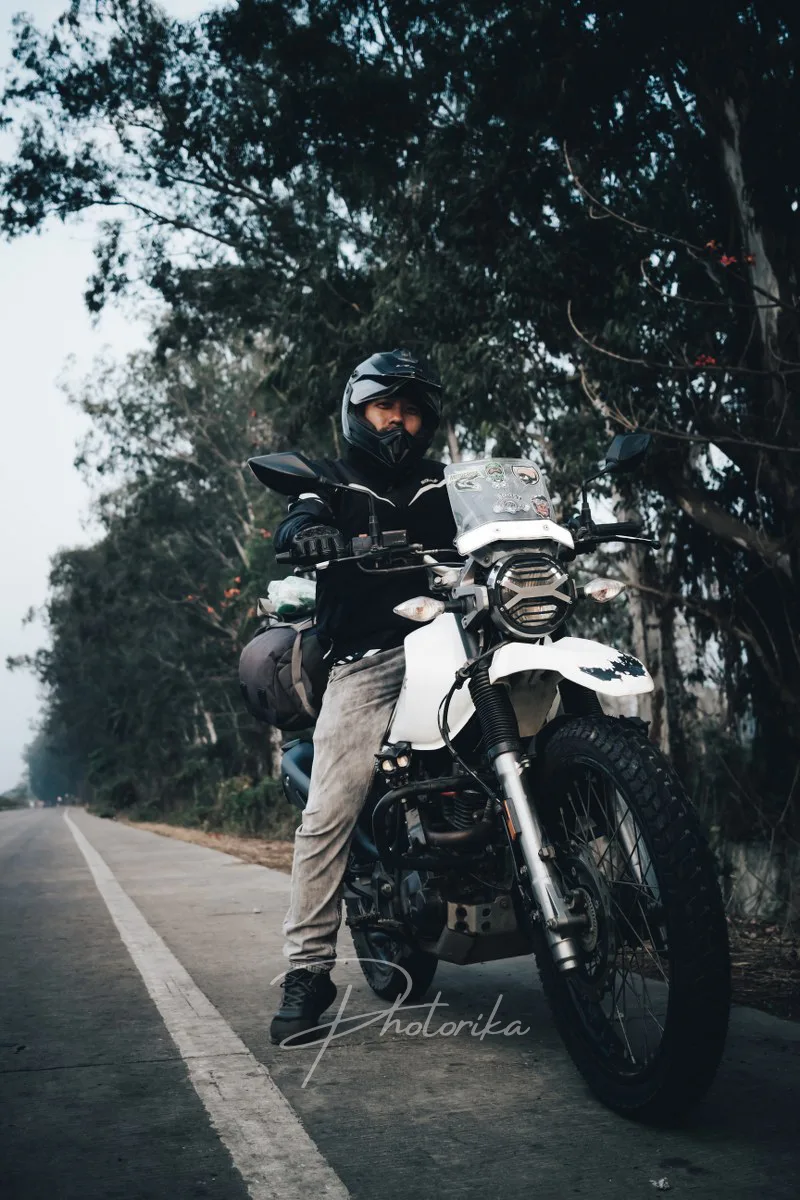 rider-in-full-riding-gear-with-his-adventure-bike-on-road-trip