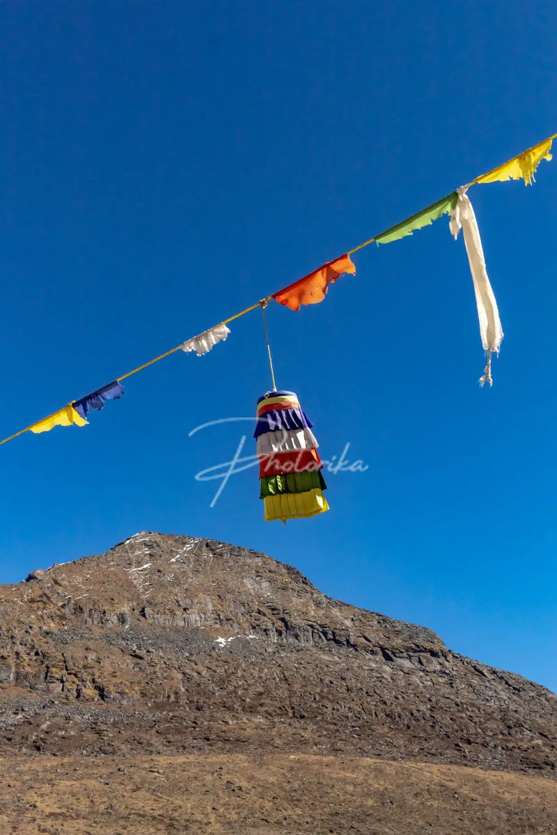 buddhist-hanging-flags-blue-sky-mountain