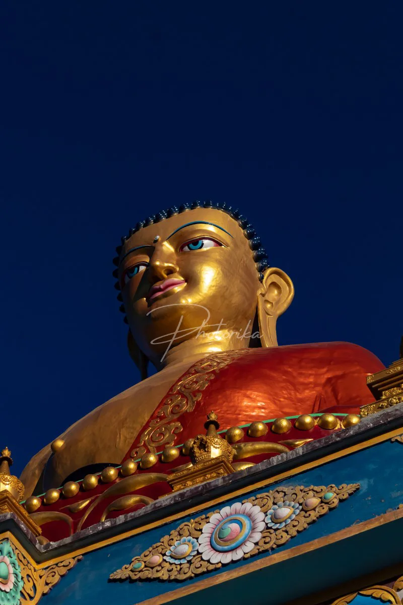 lord-buddha-statue-monastery-sun-ray-blue-sky