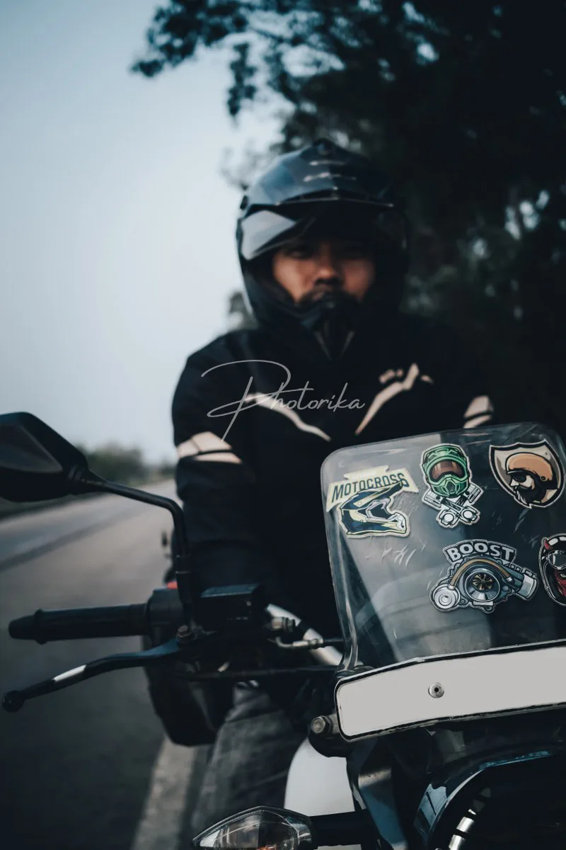 rider-in-full-gear-wearing-helmet-adventure-bike-portrait