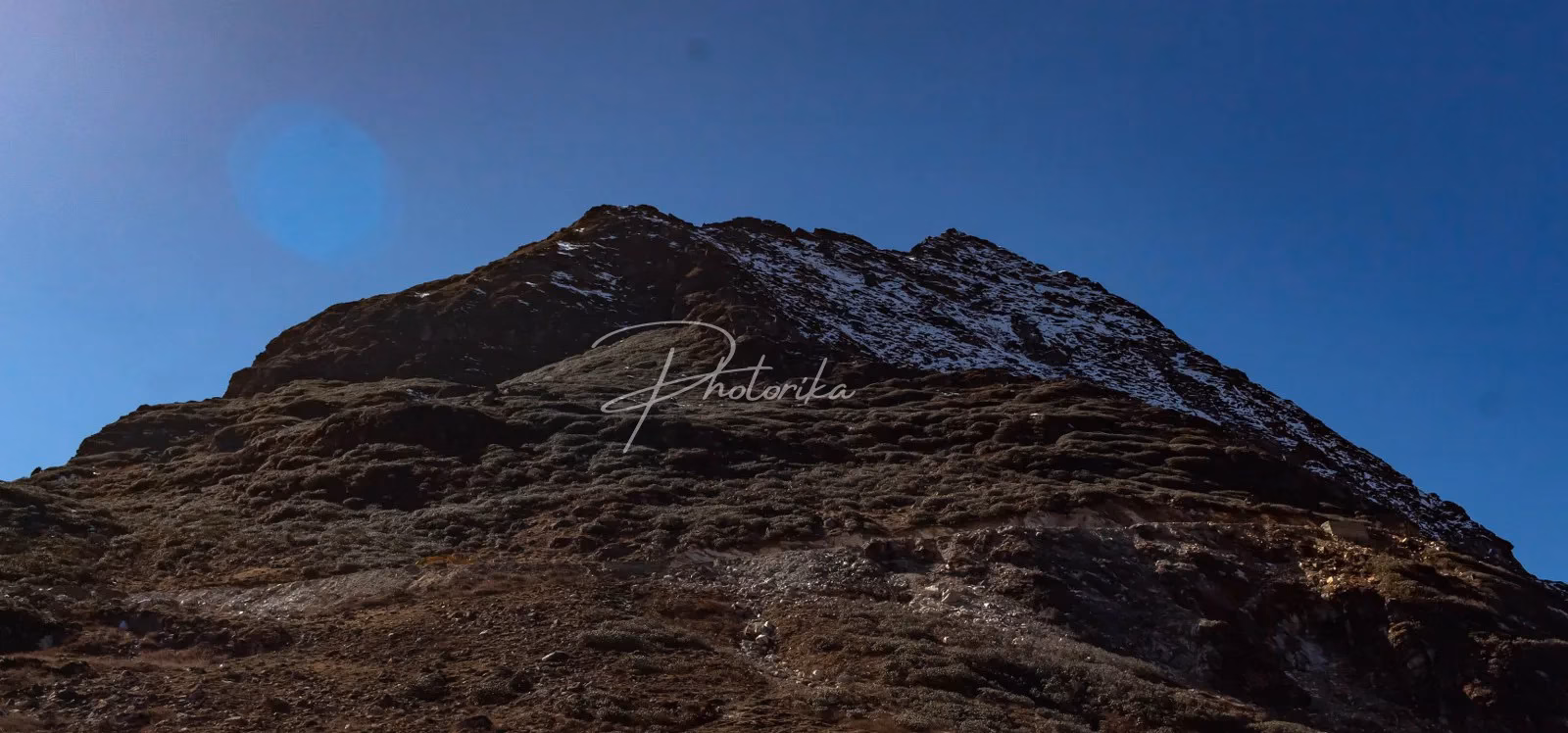 dark-mountain-snow-blue-sky