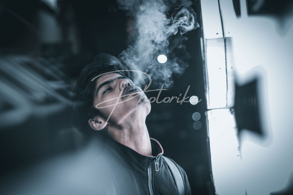 man-in-black-dress-smoking